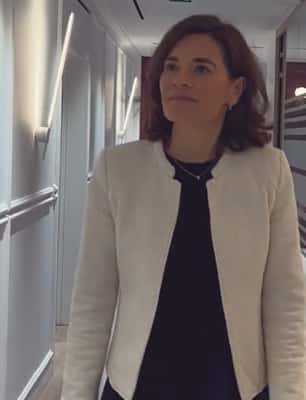 Marilyn Faugas walking down the corridor in Sompo's Paris office.