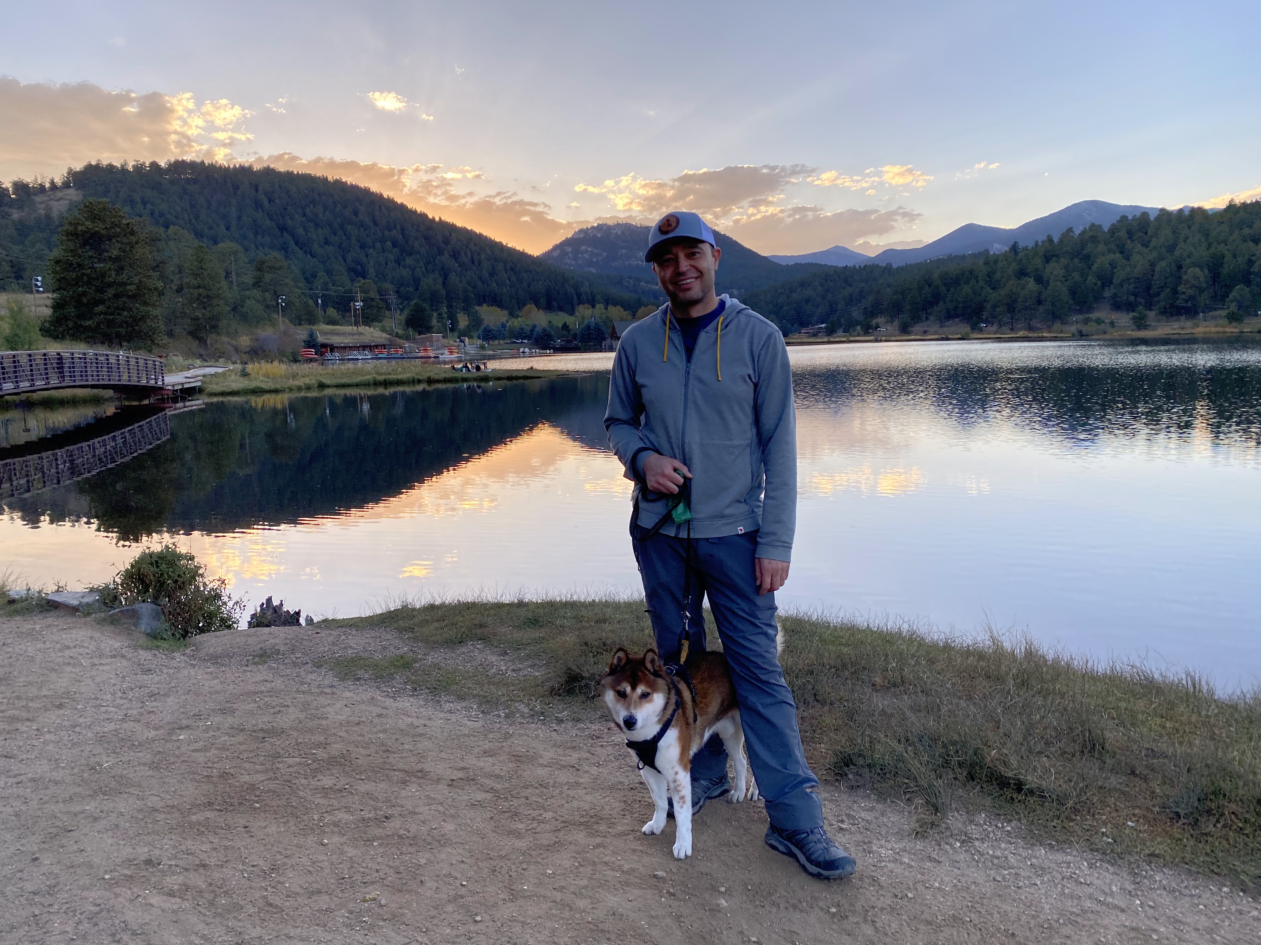 Marco Vivas hiking with his dog at sunset